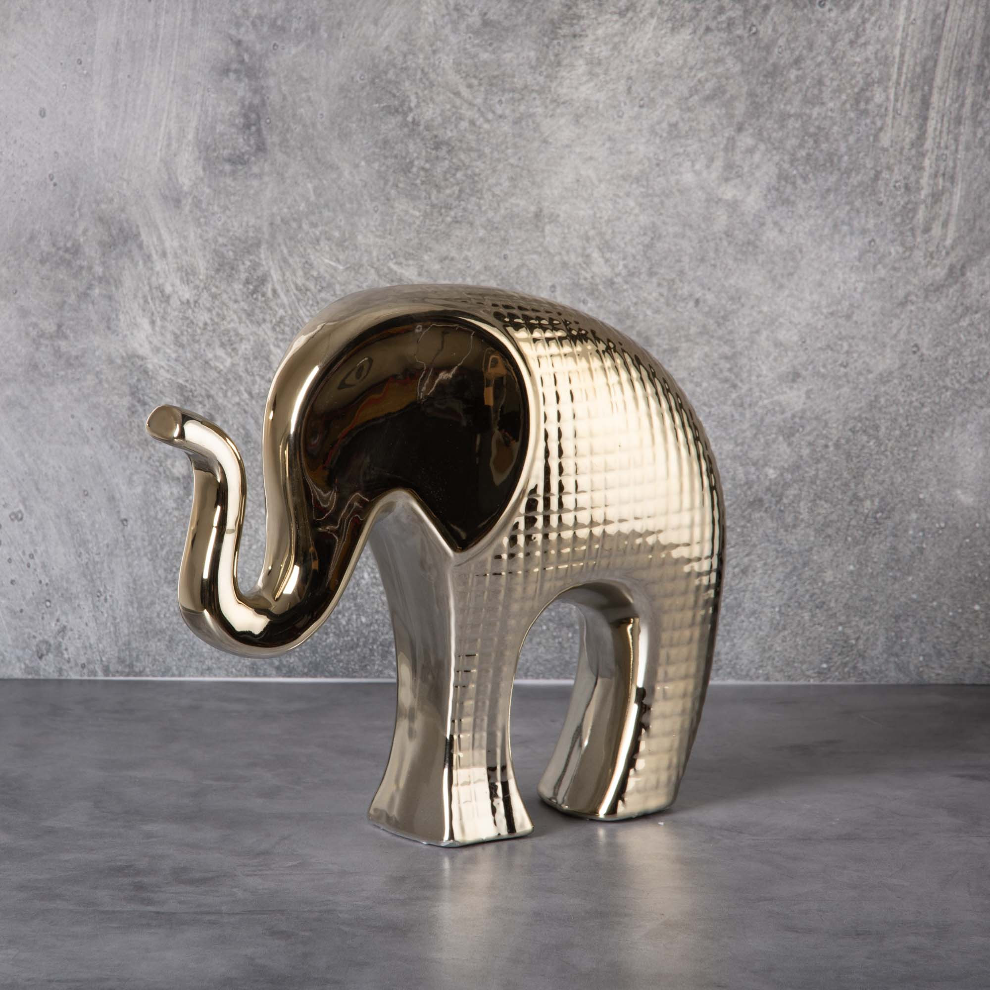 Figura Elefante Dorado Haus elaborada en cerámica.